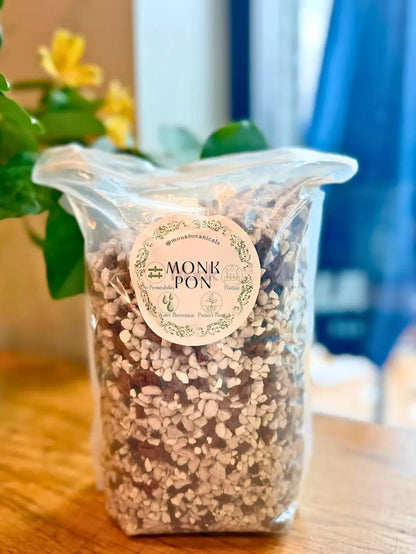Clear bag of Monk PON product with a label on a wooden surface.